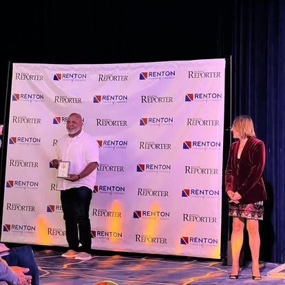 C. Davis accepting a community award in Renton